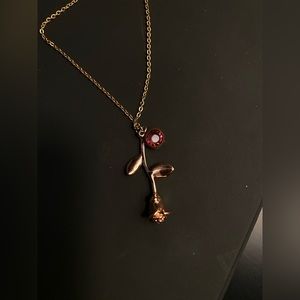 Rose gold rose necklace with gem on it
Only worn once